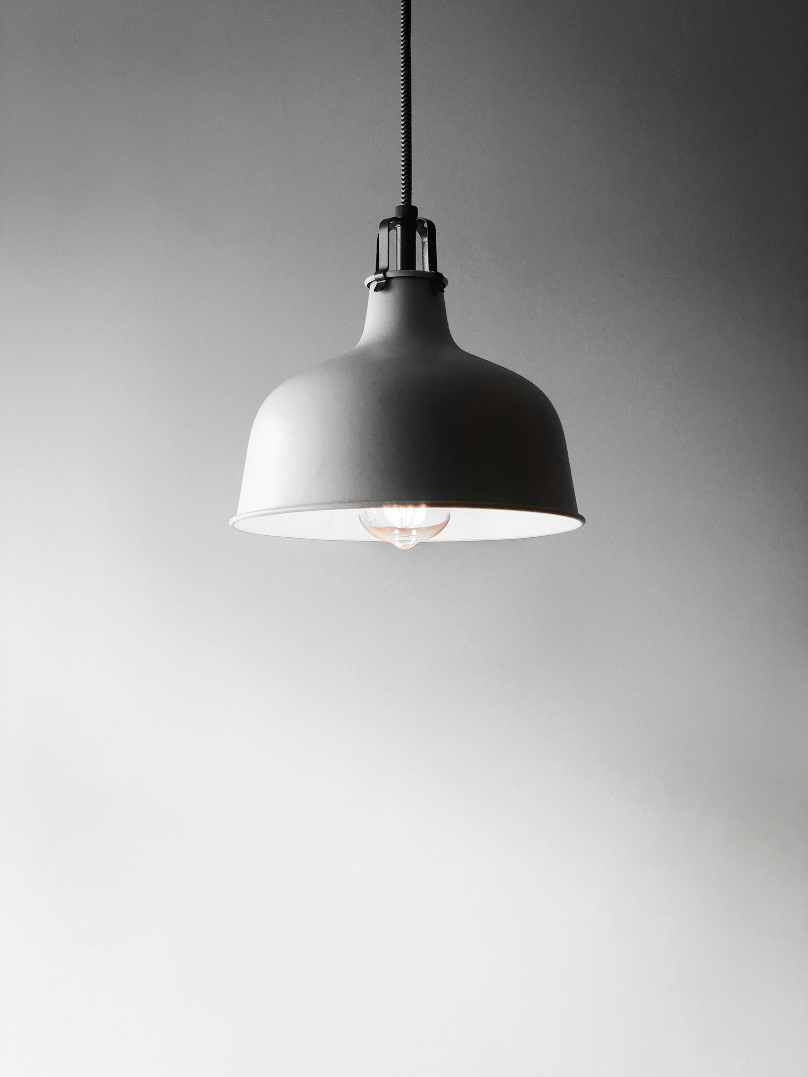 Modern AE LED pendant lighting illuminating a contemporary interior
